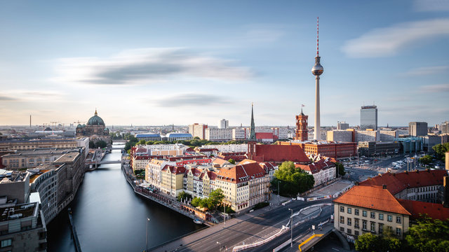 Berlin skyline panorama with TV tower and Spree river at sunset, Germany