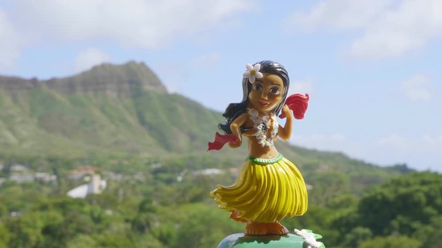Hula Girl Doll dancing on the hawaiian background in 4K Slow motion 60fps