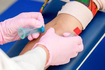 Nurse taking blood.