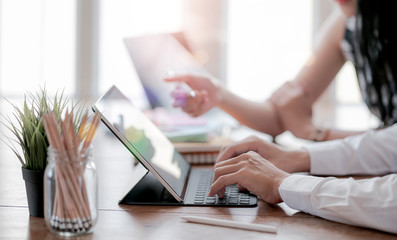 Cropped shot of businesspeople discussing business strategy in modern office.