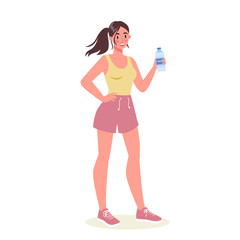 Beautiful fit woman standing and holding bottle of water.