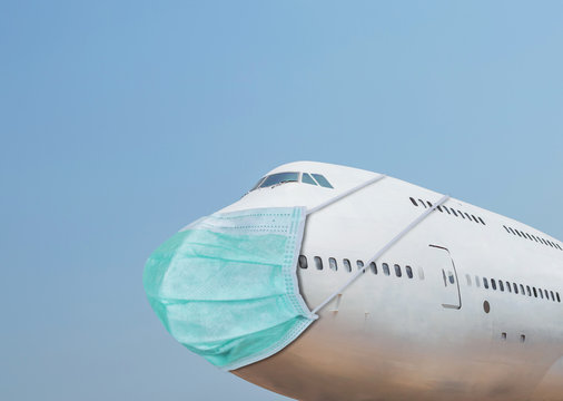 Airplane wearing face hygienic mask for protection outbreak spreading coronavirus Covid- 19 and air pollution dust pm2.5 Coronovirus and air pollution dust protection concept
