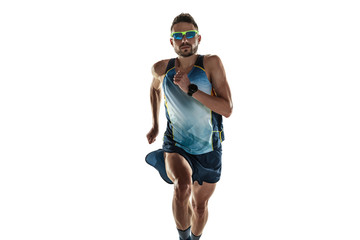 Triathlon male athlete running isolated on white studio background. Caucasian fit jogger, triathlete training wearing sports equipment. Concept of healthy lifestyle, sport, action, motion. In jump. - obrazy, fototapety, plakaty
