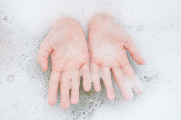 Fototapeta premium Child washing hand in bathroom.