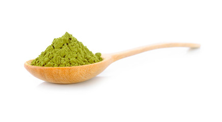 Powdered matcha green tea with spoon on white background