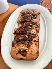 Homemade Organic Healthy Banana Bread Cake Slices with Chocolate Pieces and Walnut.