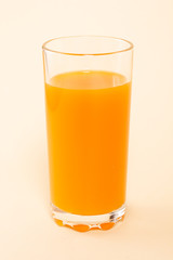 Multifruit juice is poured into a glass