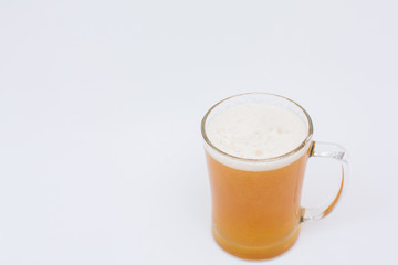 Man holding beer mug full of beer on wooden table on white background