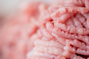 Closeup view photography of pink fresh texture of minced pork meat made at home with help of...