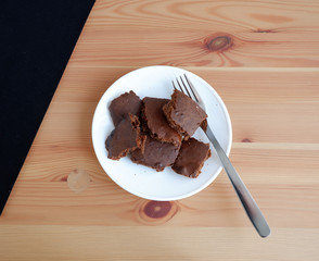 Brownie cakes, on a wooden background