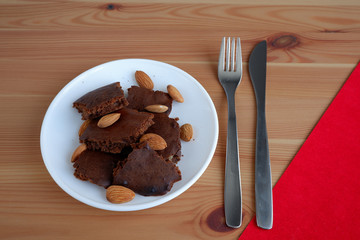 Brownie cakes, on a wooden background
