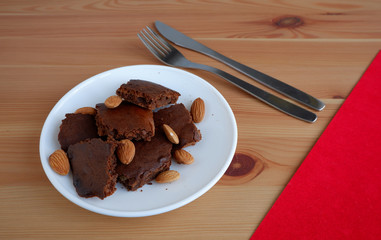 Brownie cakes, on a wooden background