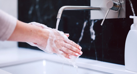 Washing hands with foam soap. Hygiene, preventing coronavirus
