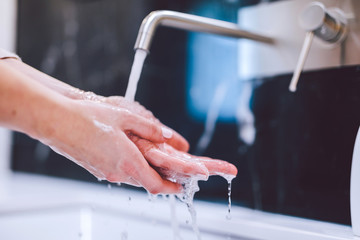 Washing hands with foam soap. Hygiene, preventing coronavirus