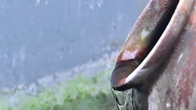 Close up of water fountain flowing from ceramic jug