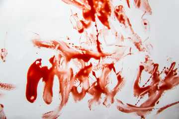 A smeared blood against white background. Bloody pattern. Concepts of blood can be used in design