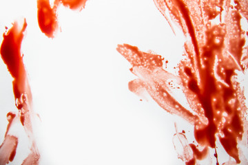 A smeared blood against white background. Bloody pattern. Concepts of blood can be used in design