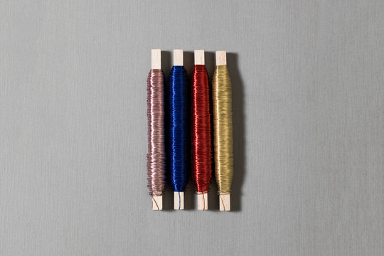 Colored wire Rolls on gray background.Waves of metal threads.High resolution photo.