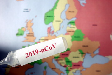 Ampoule with text 2019-nCoV and map of Europe. Coronavirus outbreak concept