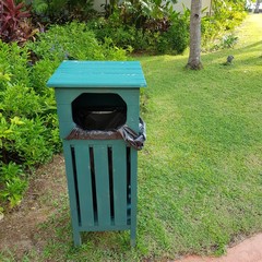 Closeup of wooden garbage bin in the garden in hotel.  Hygiene concept.