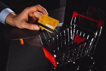 Boxes in a trolley on a laptop keyboard. Ideas about online shopping, online shopping is a form of...