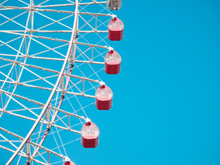 Ferris Wheel Over Blue Sky Background