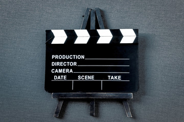 Clapperboard. Filming equipment.