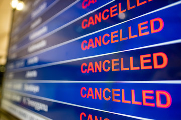 Cancelled flights board at airport due to the coronavirus