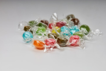 colored candies on white background