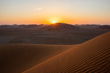 Fototapeta na wymiar Sunset in Rub al Khali the empty quarter between Oman and Saudi Arabia near Salalah