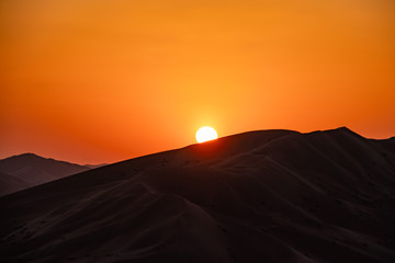 Obraz na płótnie Canvas Sunset in Rub al Khali the empty quarter between Oman and Saudi Arabia near Salalah