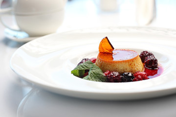 Panna cotta sweet cream dessert with fruit mousse.