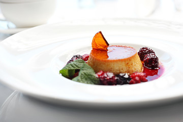 Panna cotta sweet cream dessert with fruit mousse.