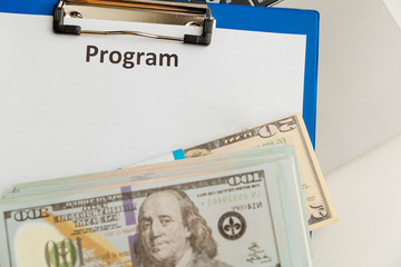 Program statement and money on the table