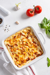 Traditional italian lasagna with vegetables, minced meat, cheese bolognese and bechamel sauce. Top view, menu, recipe