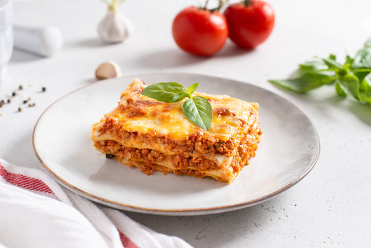 Homemade delicious Meat lasagna with basil leaf on the top. Close up. Recipe, menu. Italian cuisine
