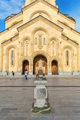 Naklejka premium Tsminda Sameba Cathedral and a model of the church in front of the temple