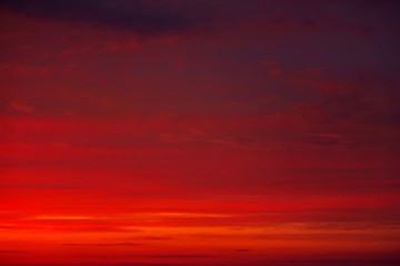 Beautiful Twilight sky background. Colorful Fiery orange and red sunset sky.