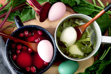 Homemade painting Easter eggs with spinach and beet dyes. Non-toxic coloring