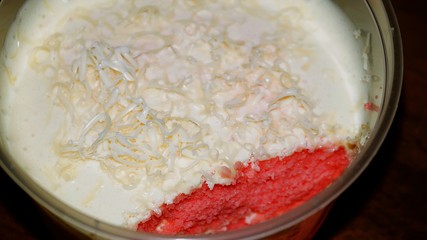 Close up Strawberry cheesecake on wooden background. Selective focus depth of field.(image contain certain grain or noise and soft focus when view at full resolution).