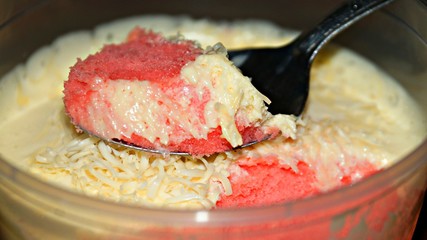 Close up Strawberry cheesecake on wooden background. Selective focus depth of field.(image contain certain grain or noise and soft focus when view at full resolution).