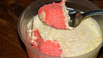 Close up Strawberry cheesecake on wooden background. Selective focus depth of field.(image contain certain grain or noise and soft focus when view at full resolution).