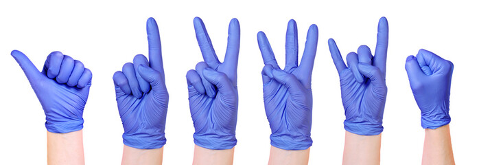 Collection of isolated hands wearing purple medical gloves