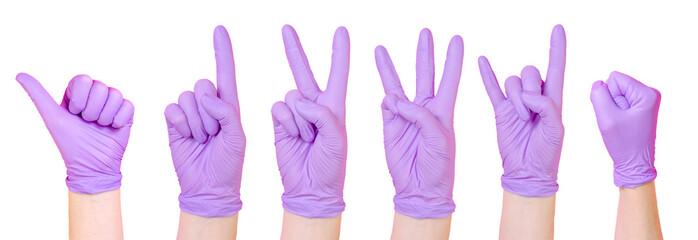 Collection of isolated hands wearing purple medical gloves