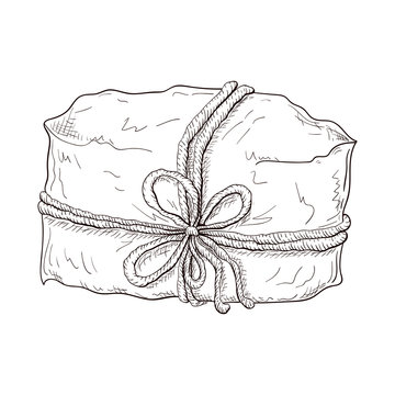 Hand drawn gift illustration. paper wrapped package tied with cord or twine. Vintage engraved gift box icon. present or paper wrapped parcel sketch isolated on white background. box with string bow.