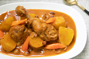 Chicken Mussaman Curry is one of the most delicious savory Thai curry dishes. Creamy chicken curry with nuts and soft cooked potatoes served over fluffy.