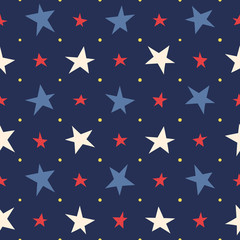 Seamless pattern. Stars red, blue, white on a dark blue background. Vector.
