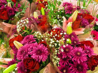A bright bouquet of different flowers shot from above in a flower shop.