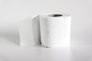 Roll of toilet papers on a soft color background.