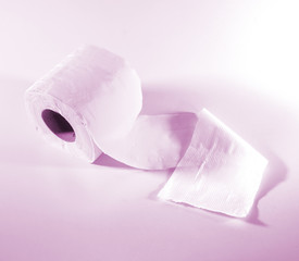 Roll of toilet papers on a soft color background.
